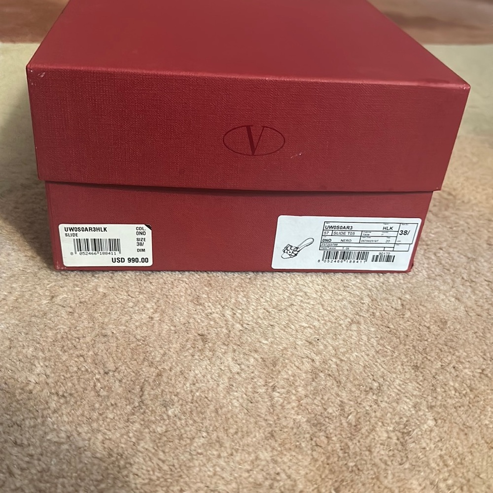 Brand new Valentino slides size 8 1/2 fits like a 8